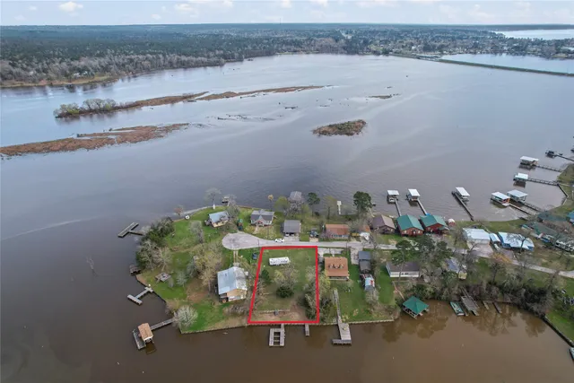 an aerial view of a house with yard