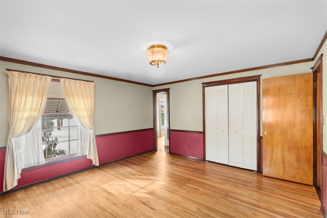 3609 Brinkmore Road Cleveland, OH 44121 - Photo 22 of 50 bedroom featuring crown molding and light hardwood flooring