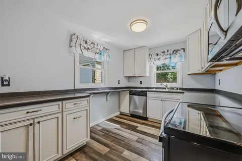 a kitchen that has a sink and a stove