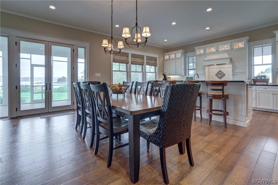 34 Crabshell Lane Kilmarnock, VA 22482 - Photo 12 of 50 a view of a dining room with furniture window and wooden floor