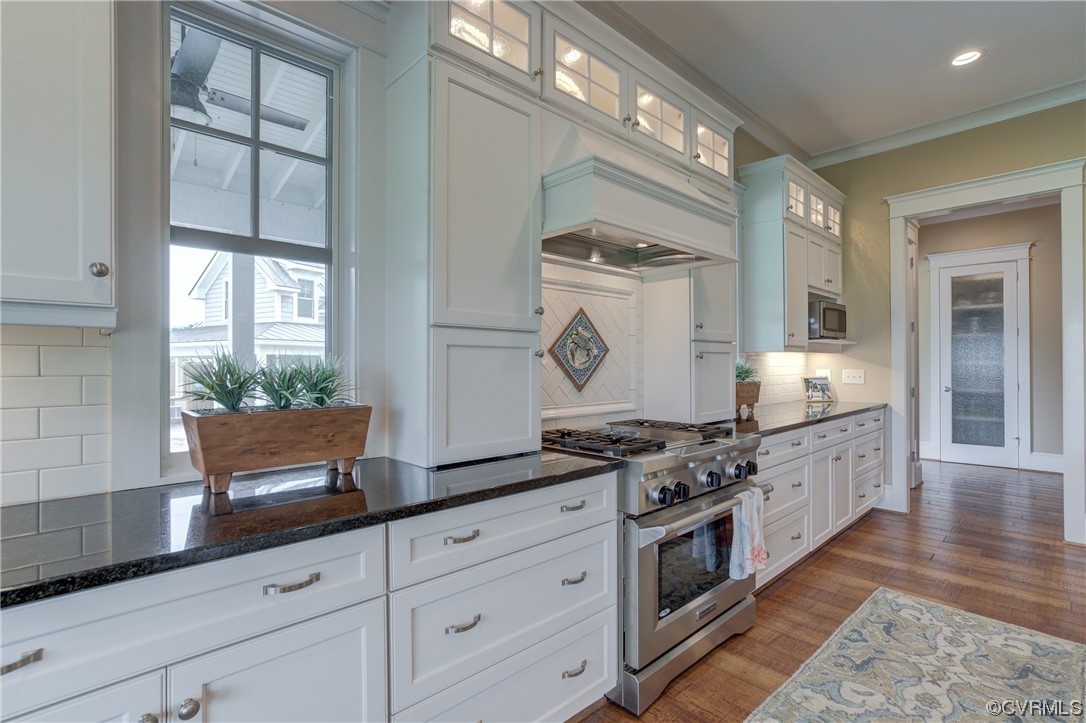 34 Crabshell Lane Kilmarnock, VA 22482 - Photo 14 of 50 a kitchen with stainless steel appliances granite countertop a stove and a granite counter tops