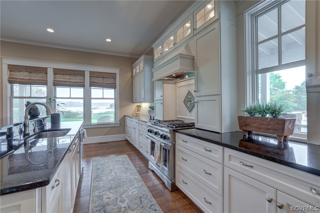 34 Crabshell Lane Kilmarnock, VA 22482 - Photo 16 of 50 a large kitchen with stainless steel appliances a stove a sink and a large window