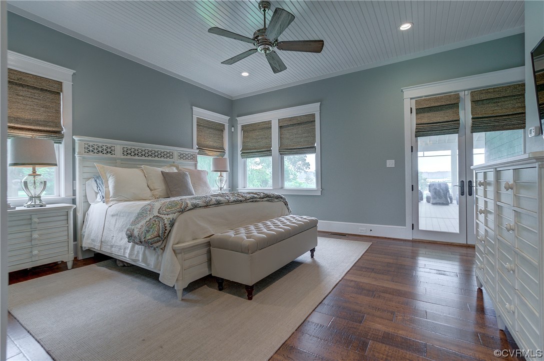 34 Crabshell Lane Kilmarnock, VA 22482 - Photo 18 of 50 a bedroom with a large bed and a chandelier fan