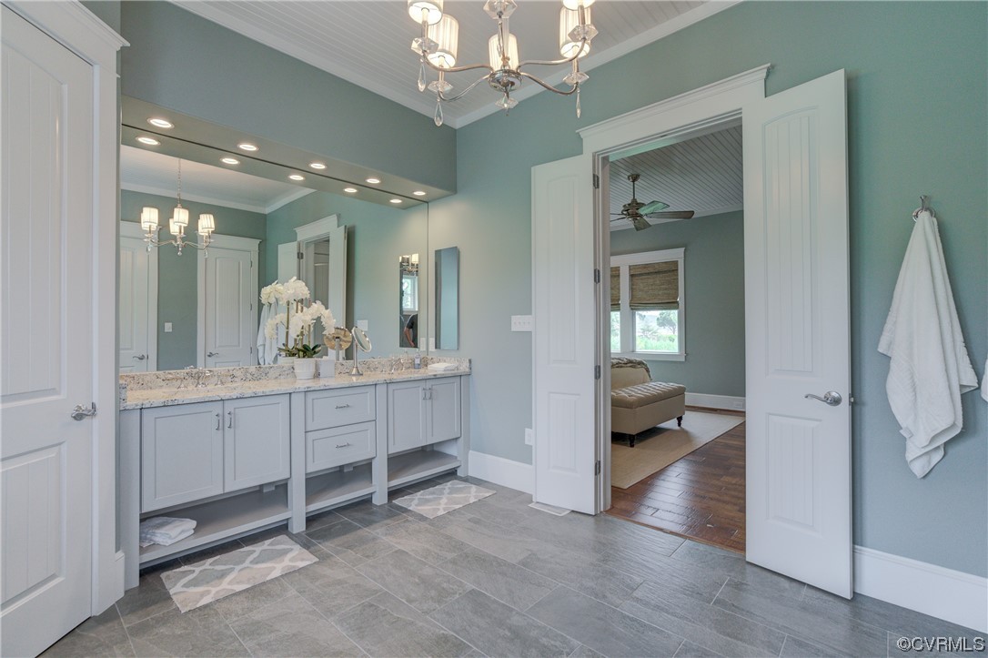 34 Crabshell Lane Kilmarnock, VA 22482 - Photo 20 of 50 a bathroom with a double vanity sink and a mirror