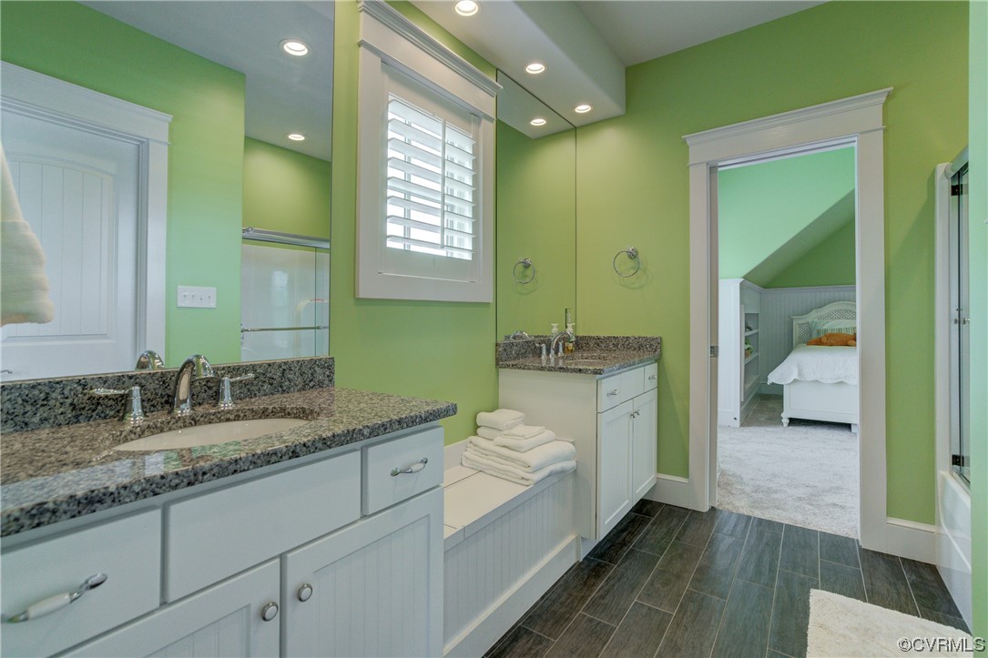 34 Crabshell Lane Kilmarnock, VA 22482 - Photo 29 of 50 a bathroom with a granite countertop sink and a mirror