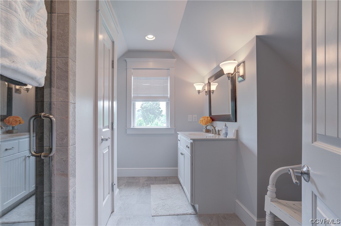 34 Crabshell Lane Kilmarnock, VA 22482 - Photo 34 of 50 a bathroom with a mirror sink and vanity