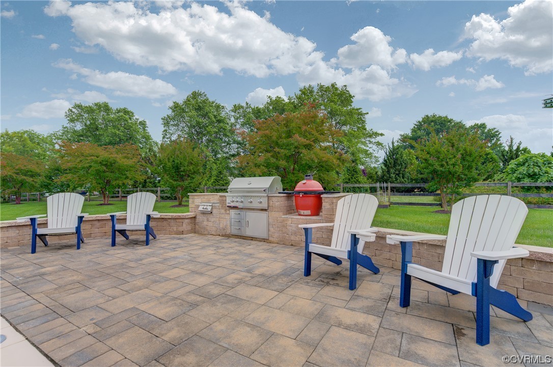 34 Crabshell Lane Kilmarnock, VA 22482 - Photo 36 of 50 a view of a chairs and tables in the back yard of the house