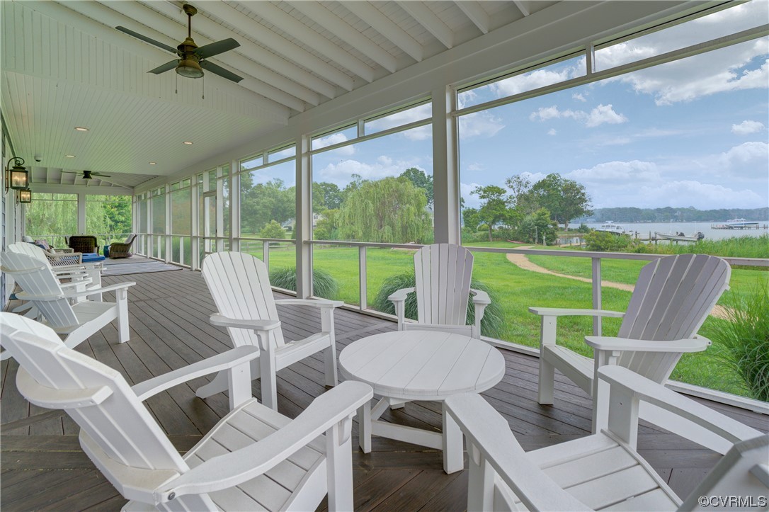 34 Crabshell Lane Kilmarnock, VA 22482 - Photo 41 of 50 a view of a patio with a table chairs and a backyard