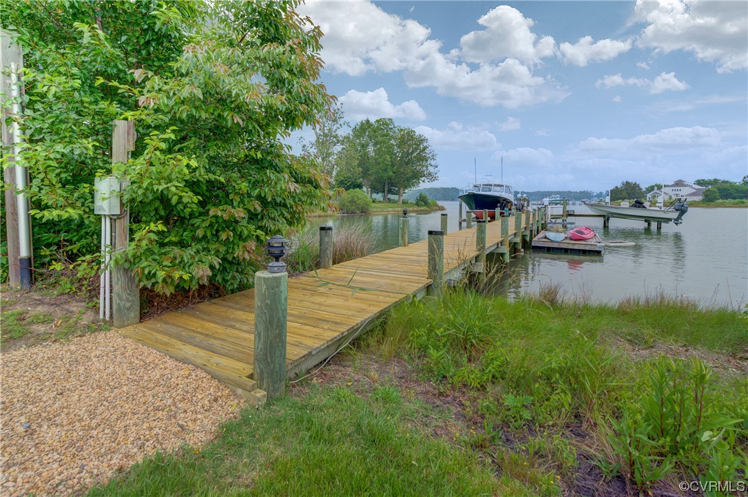 34 Crabshell Lane Kilmarnock, VA 22482 - Photo 44 of 50 a view of a lake with a yard