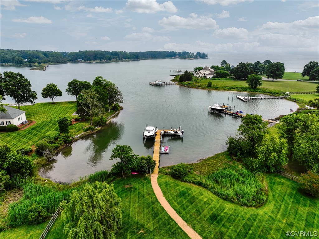 34 Crabshell Lane Kilmarnock, VA 22482 - Photo 45 of 50 a view of a lake with houses in the back