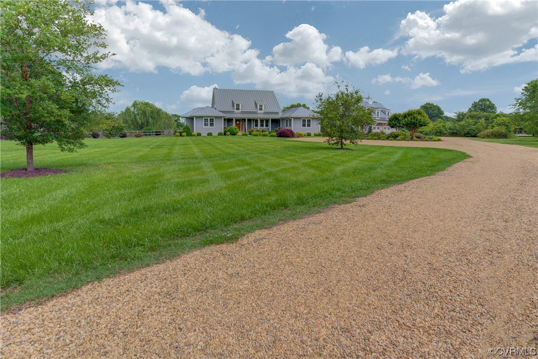 34 Crabshell Lane Kilmarnock, VA 22482 - Photo 5 of 50 a view of a big yard with palm trees