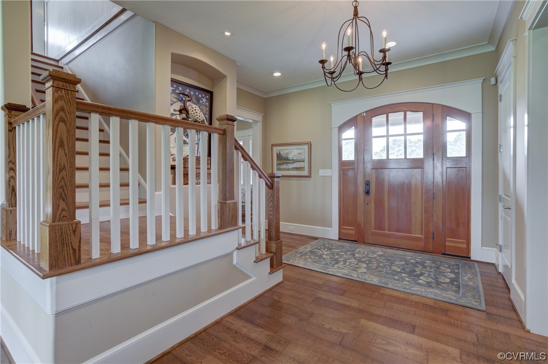 34 Crabshell Lane Kilmarnock, VA 22482 - Photo 8 of 50 a view of entryway with stairs and wooden floor