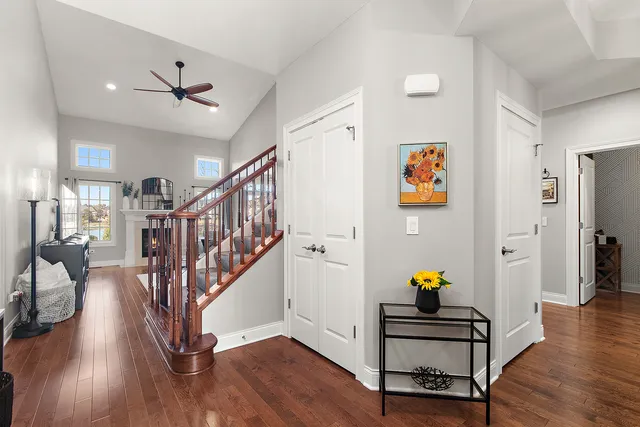 a view of entryway with wooden floor and stairs