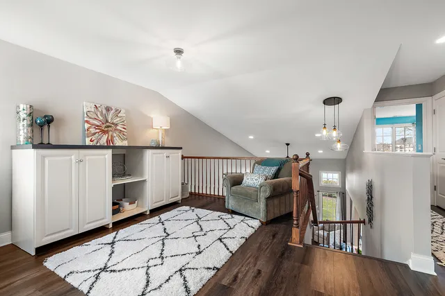 a lobby with furniture and wooden floor