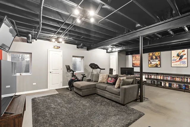 a living room with furniture or chandelier and a window