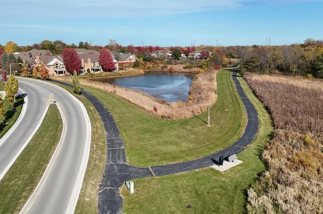 a view of a swimming pool with a lake and mountain view