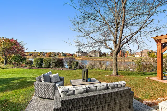 a view of a deck with couches table and chairs