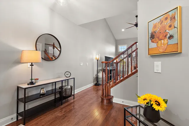 a front view of a house with wooden floor and furniture