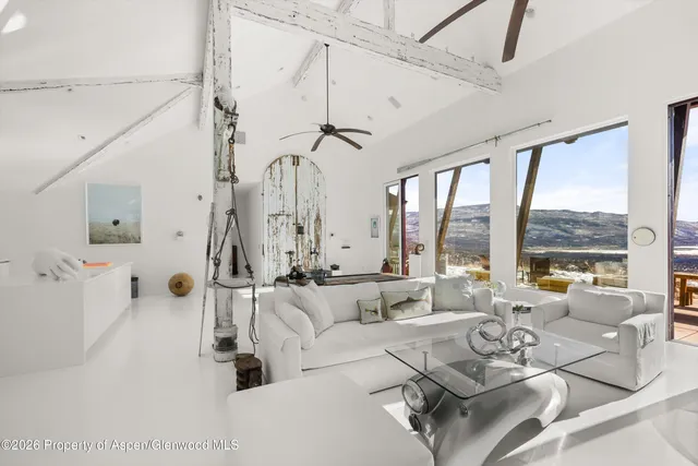 a view of a patio with a table and chairs