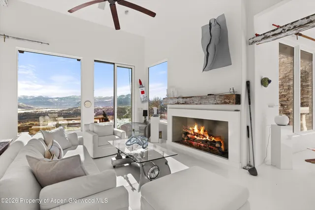 a living room with fireplace furniture and a fireplace