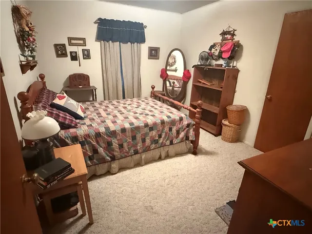 a view of a hallway with wooden floor and entryway