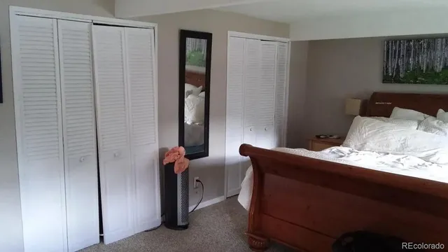 a room with a bed and a window