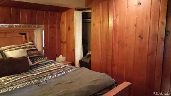 a bedroom with a bed and furniture