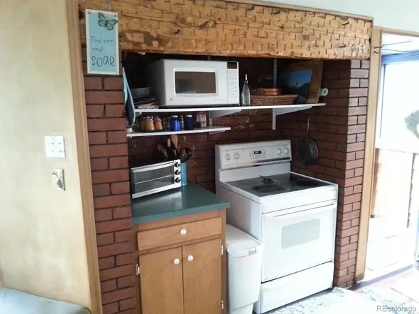 a kitchen with a stove and a microwave