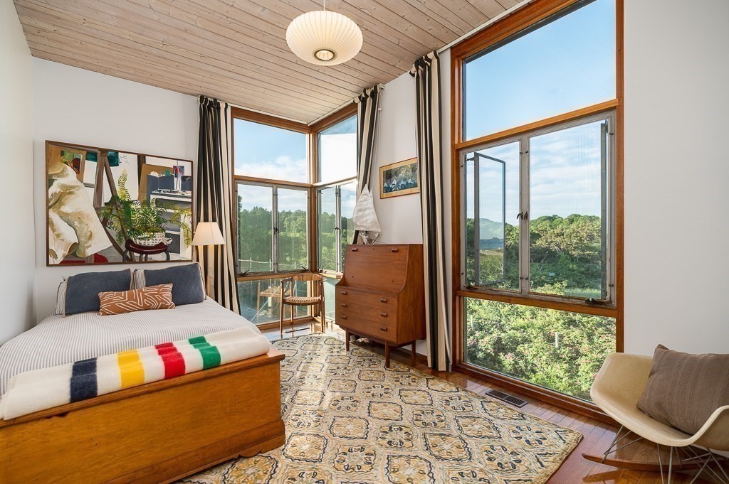 68 Paine Avenue Beverly, MA 01915 - Photo 17 of 32 a living room with furniture and a floor to ceiling window