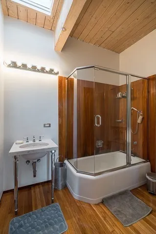 a bathroom with a bathtub and a shower