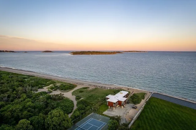 an aerial view of a house with a yard