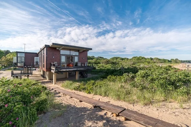 a view of a lake with a house in the background
