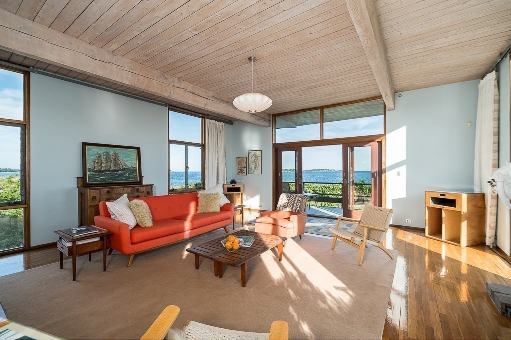 68 Paine Avenue Beverly, MA 01915 - Photo 7 of 32 a living room with furniture a ceiling fan and a large window