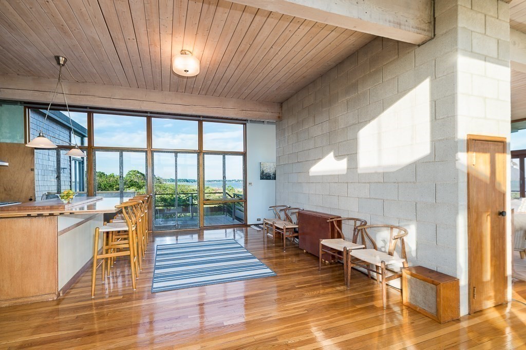 68 Paine Avenue Beverly, MA 01915 - Photo 10 of 32 a living room with furniture and a floor to ceiling window
