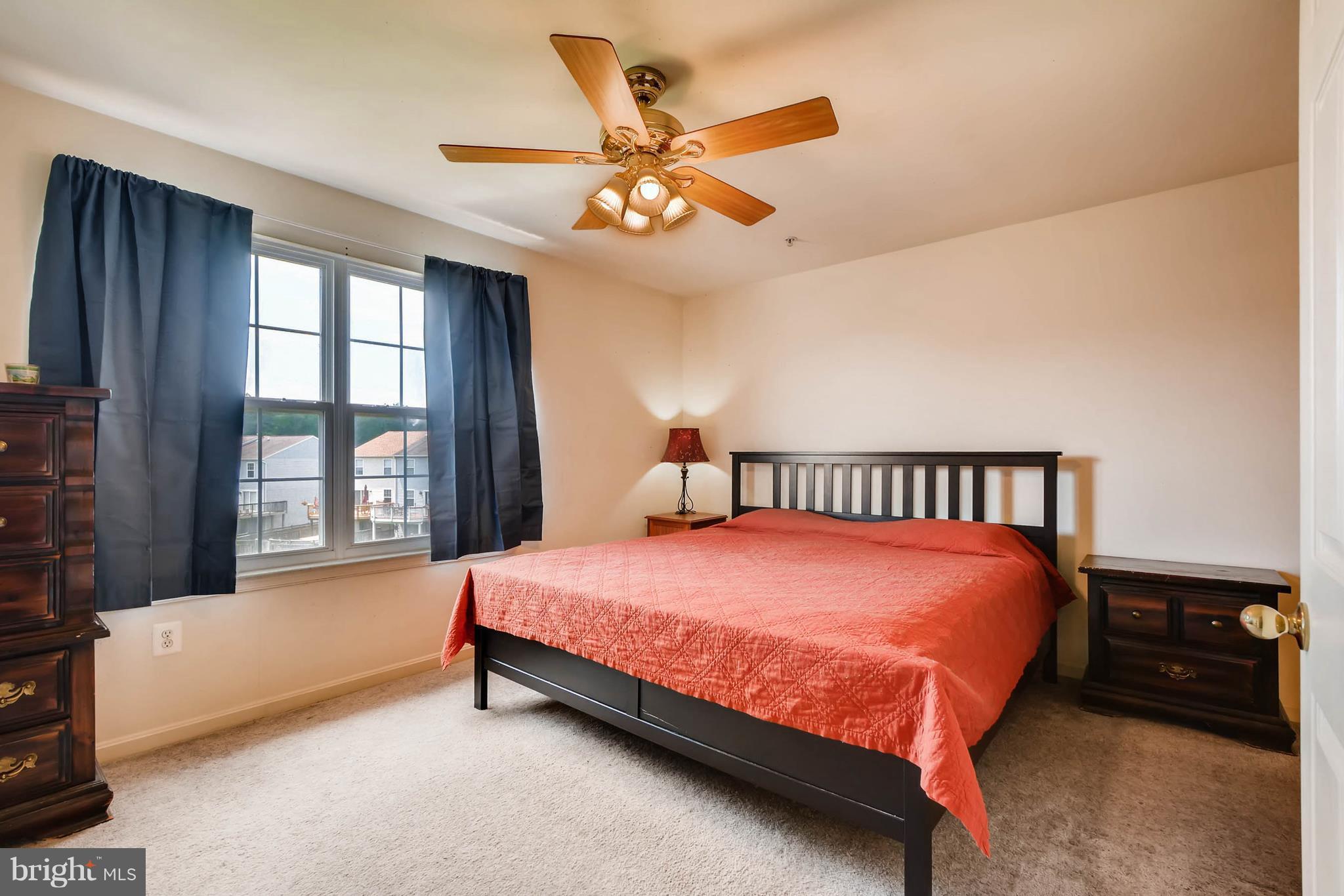 4019 Cutty Sark Road Baltimore, MD 21220 - Photo 22 of 30 a bedroom with a bed and a large window