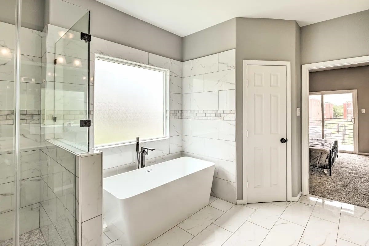 4909 Sunflower Street Houston, TX 77033 - Photo 12 of 25 a bathroom with a bathtub and shower