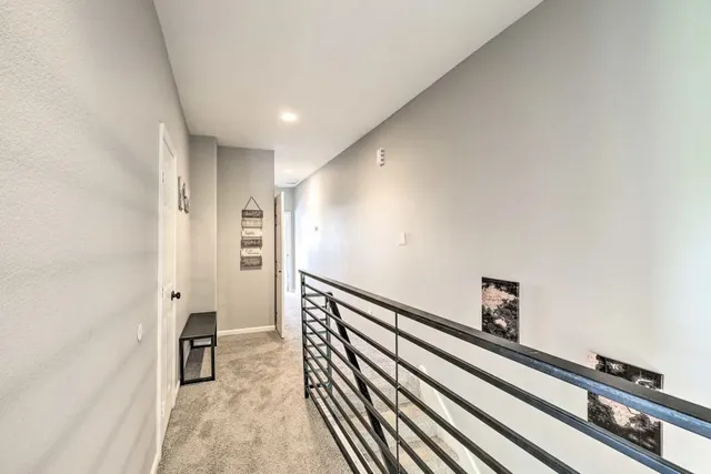 a view of a hallway with staircase