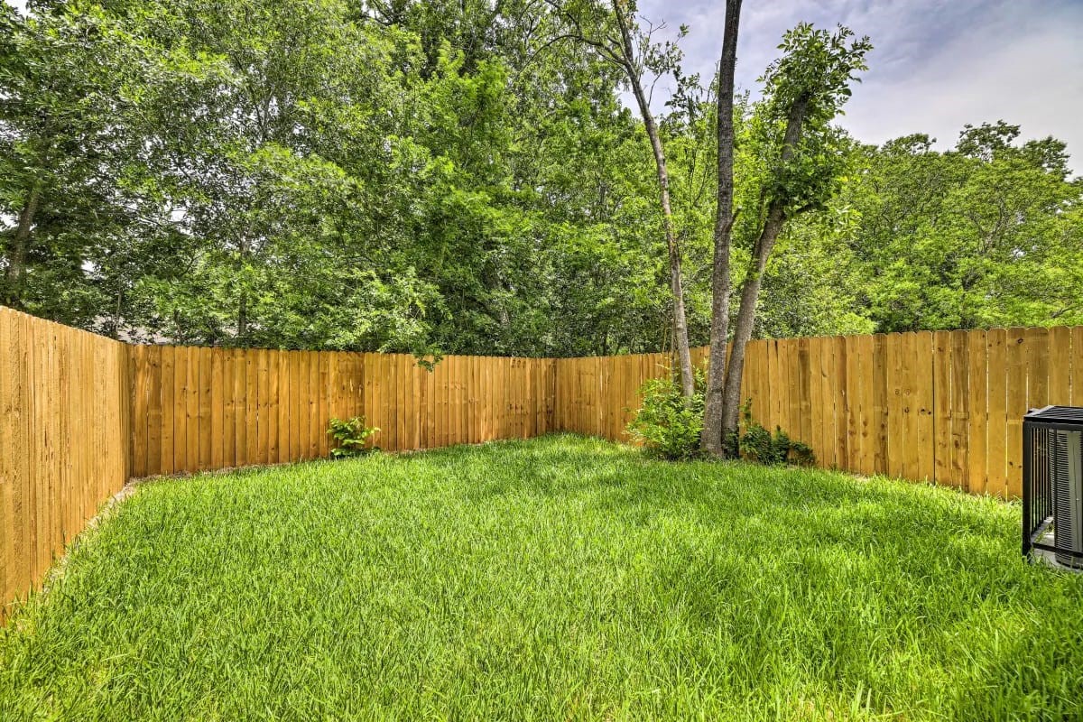 4909 Sunflower Street Houston, TX 77033 - Photo 24 of 25 a view of a backyard with wooden fence
