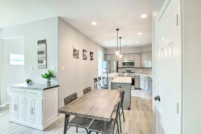 a kitchen with a table and chairs in it