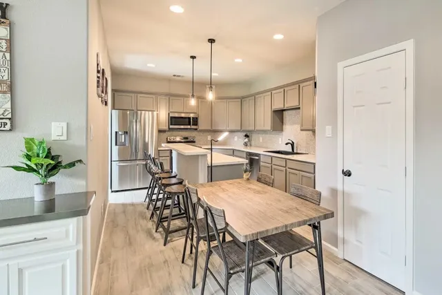 a kitchen with a table and chairs in it
