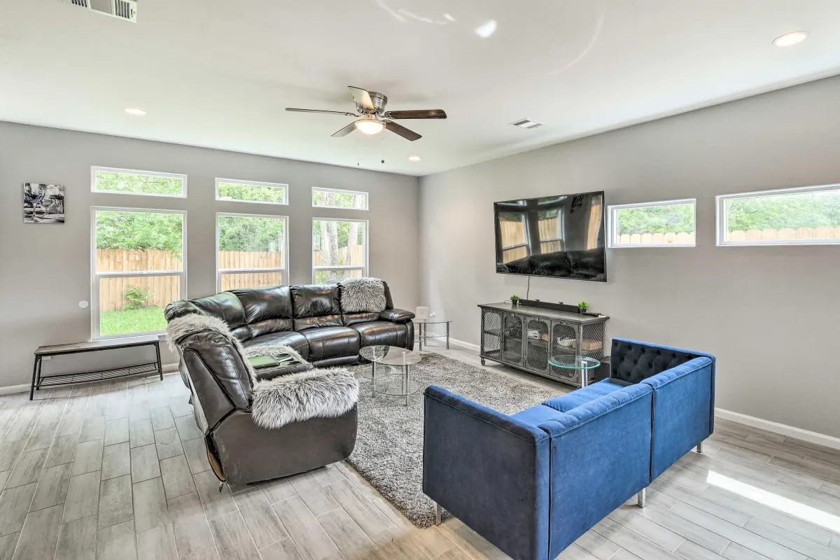 4909 Sunflower Street Houston, TX 77033 - Photo 8 of 25 a living room with fireplace furniture and a flat screen tv