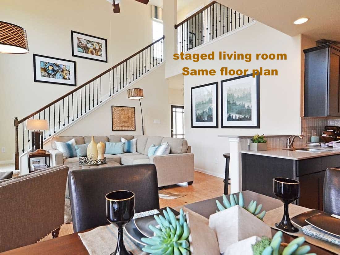 Living room with a high ceiling and ceiling fan
