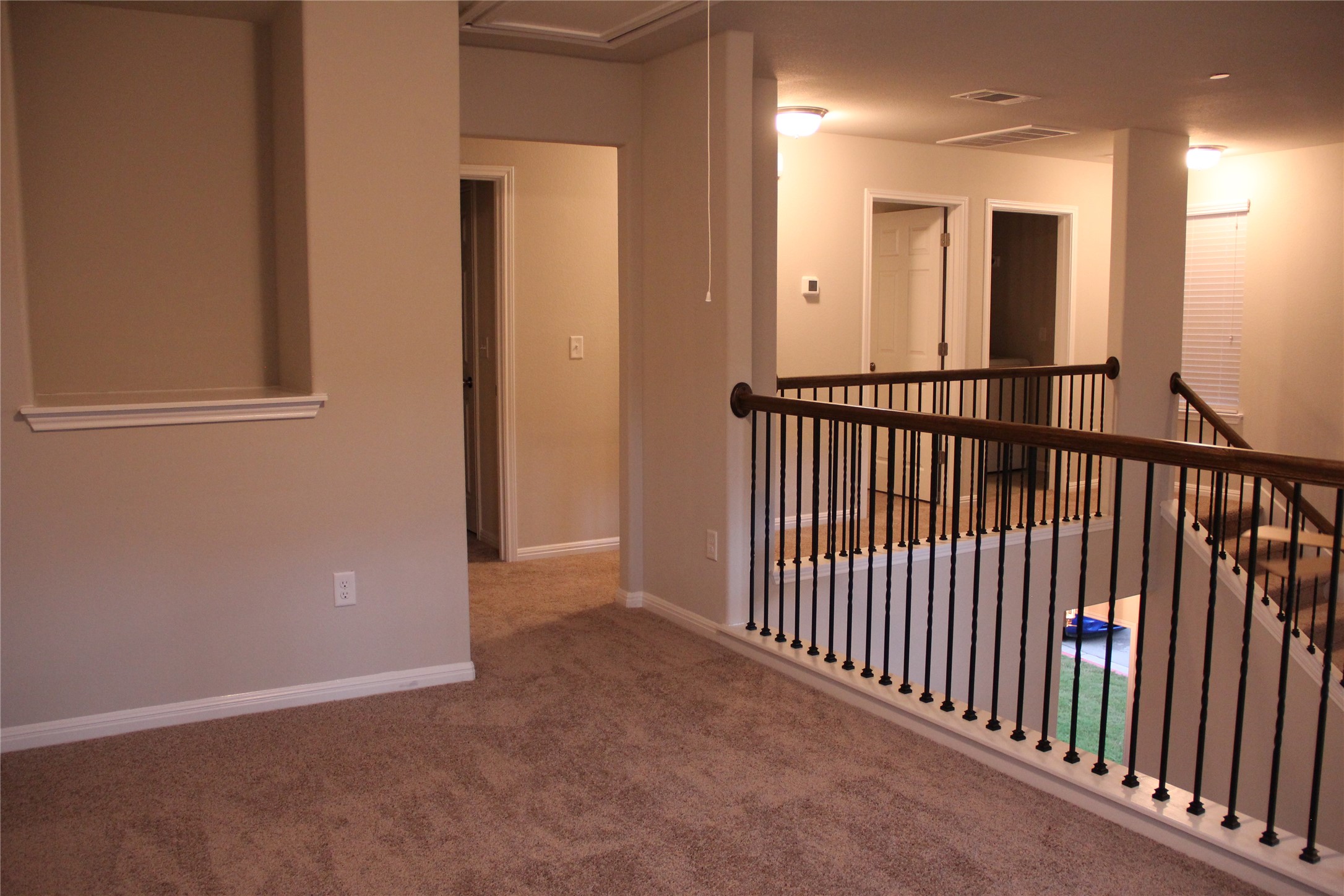 1612 Airedale Road Austin, TX 78748 - Photo 13 of 21 Hallway featuring an upstairs landing and carpet flooring