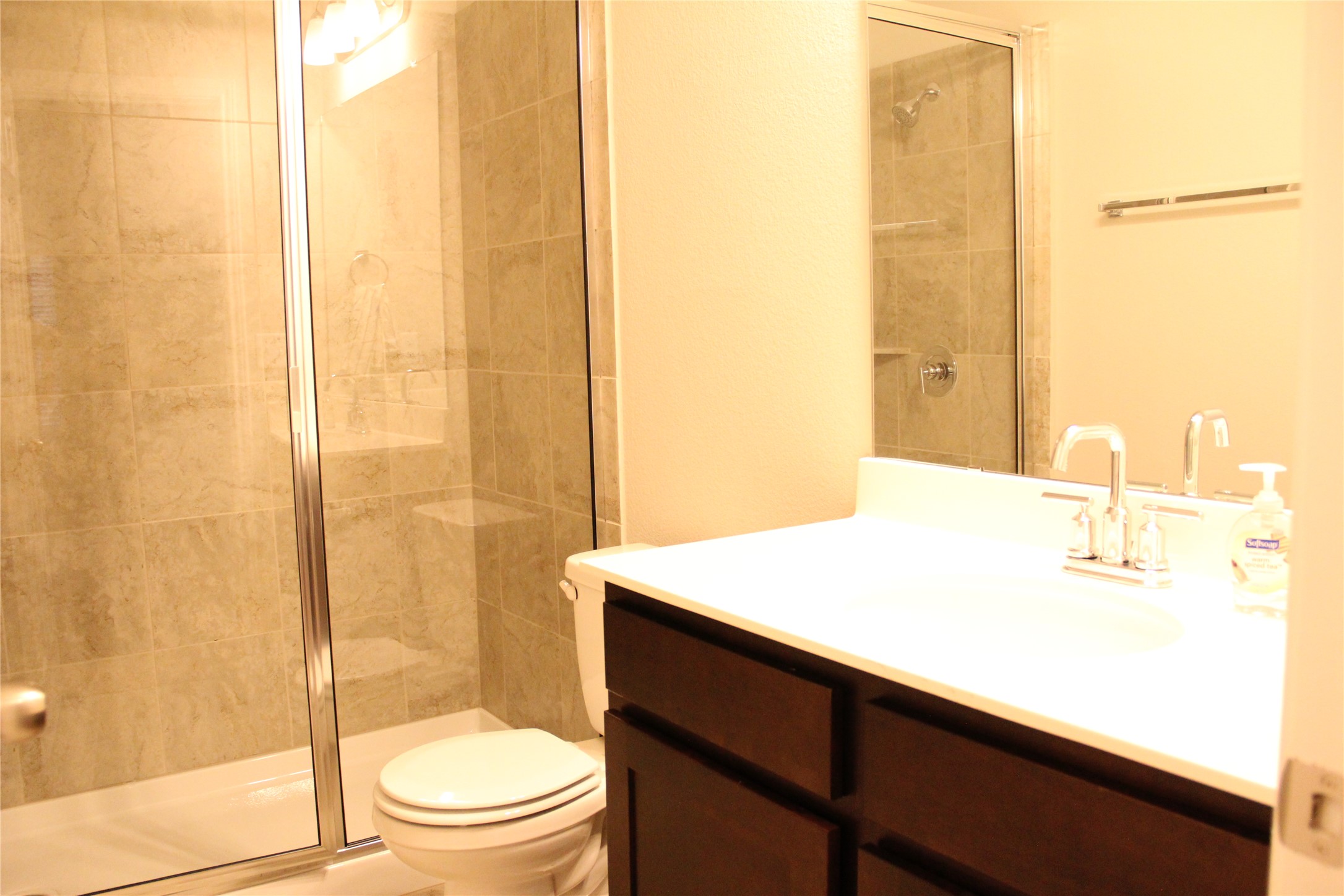 1612 Airedale Road Austin, TX 78748 - Photo 15 of 21 Bathroom featuring vanity and a stall shower
