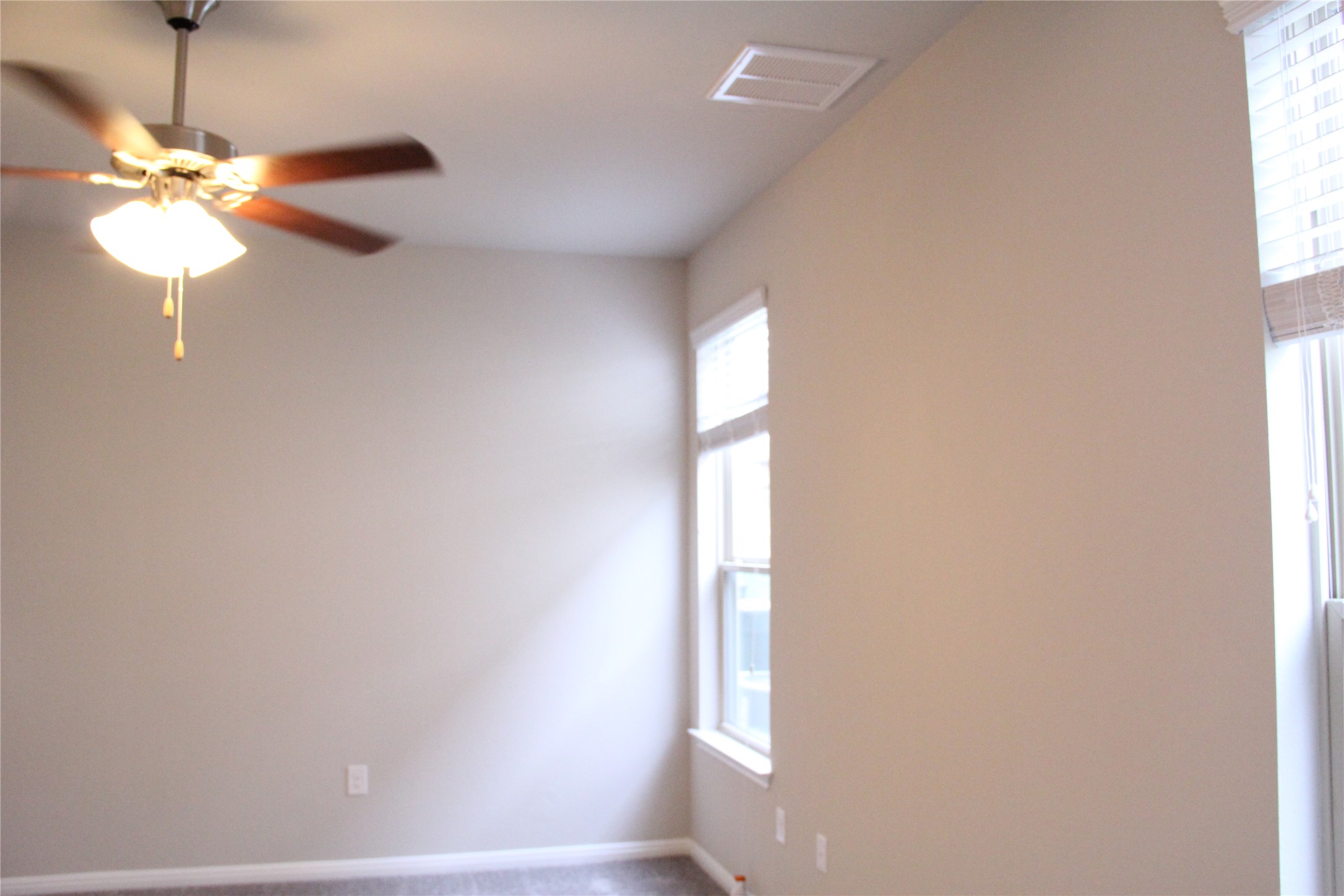 1612 Airedale Road Austin, TX 78748 - Photo 16 of 21 Empty room featuring carpet flooring and a ceiling fan