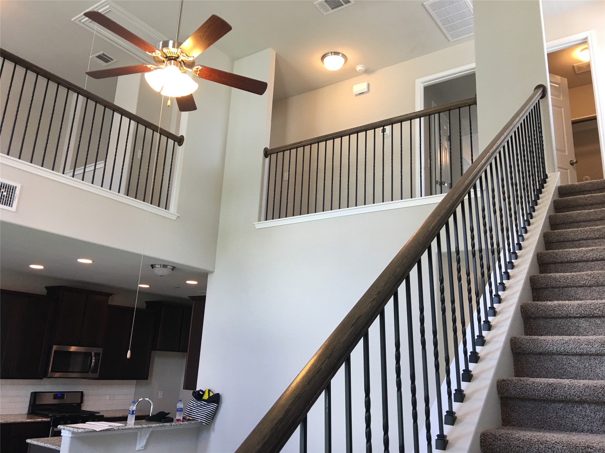 1612 Airedale Road Austin, TX 78748 - Photo 2 of 21 Stairway featuring ceiling fan and a high ceiling