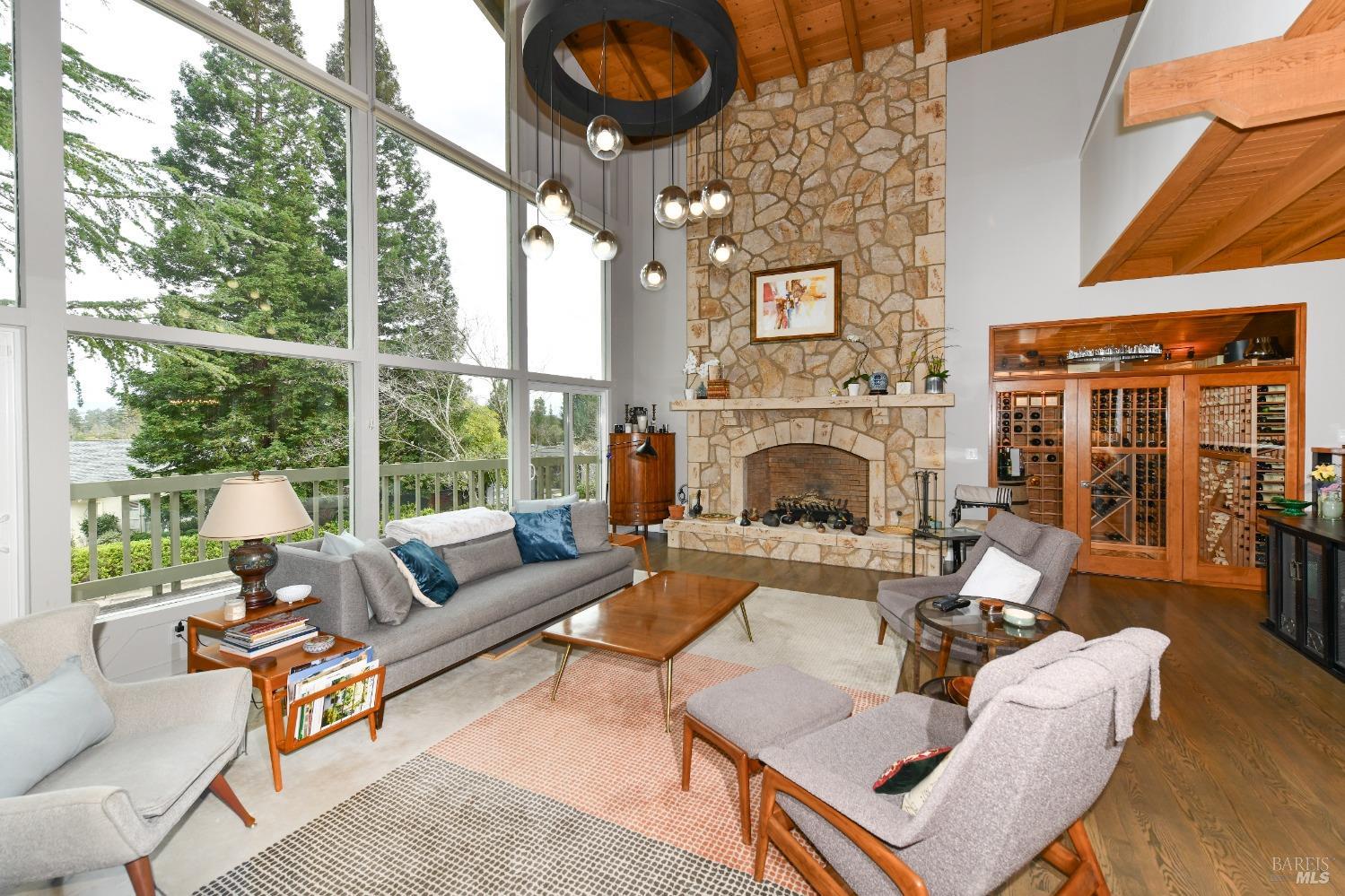 Stunning Great Room with fireplace, wine cellar, and an abundance of natural light.