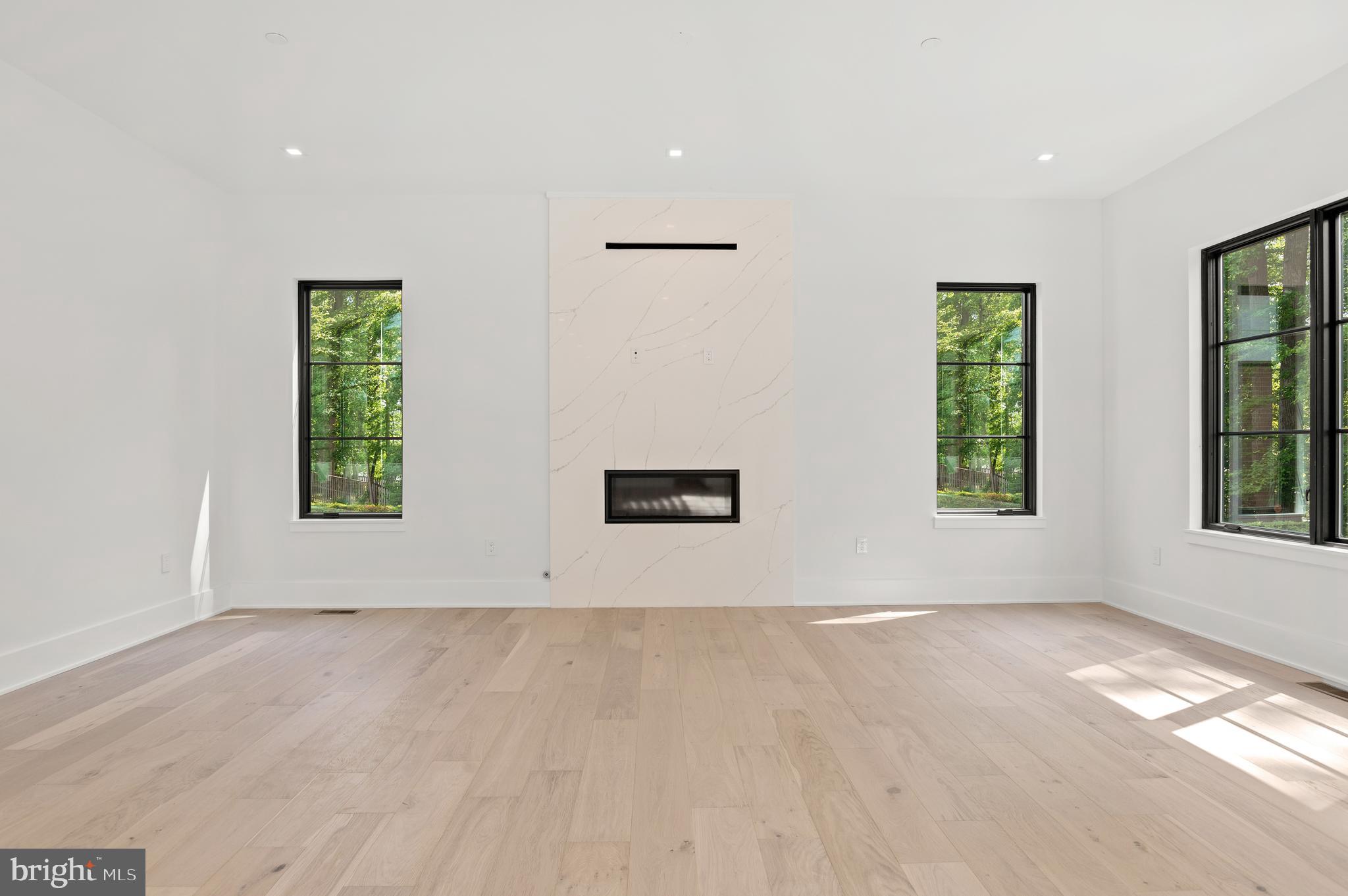 6916 Marbury Road Bethesda, MD 20817 - Photo 35 of 89 GAS FIREPLACE W/ WALL OF CALCUTTA QUARTZ WALL