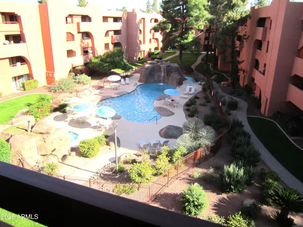 a floor to ceiling window with wooden floor