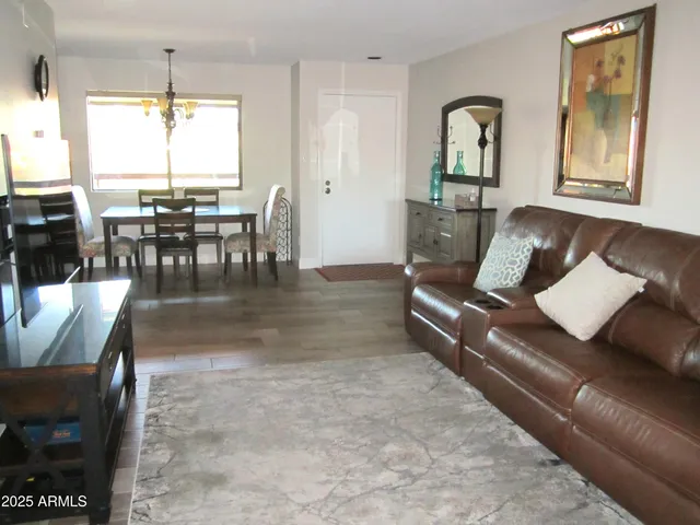 a living room with furniture and window